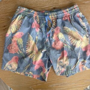 chubbies Blue Parrot Floral Swim Trunks with Pink and Yellow Accents